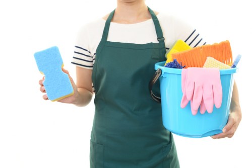 Technician performing oven cleaning in Finchley with specialist tools