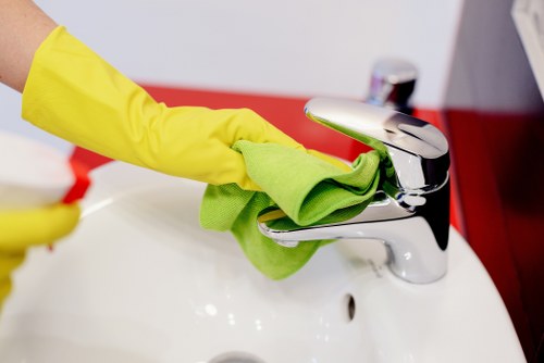 Professional office cleaners working in a Finchley workspace