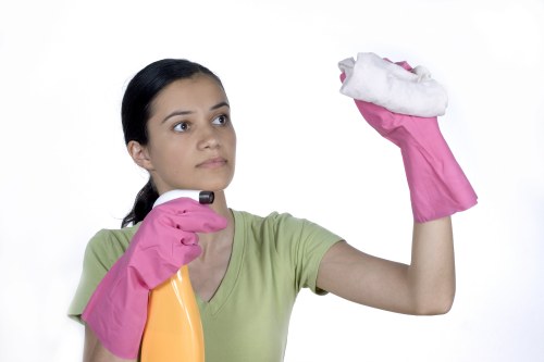 Office cleaning team maintaining desks and floors in Finchley