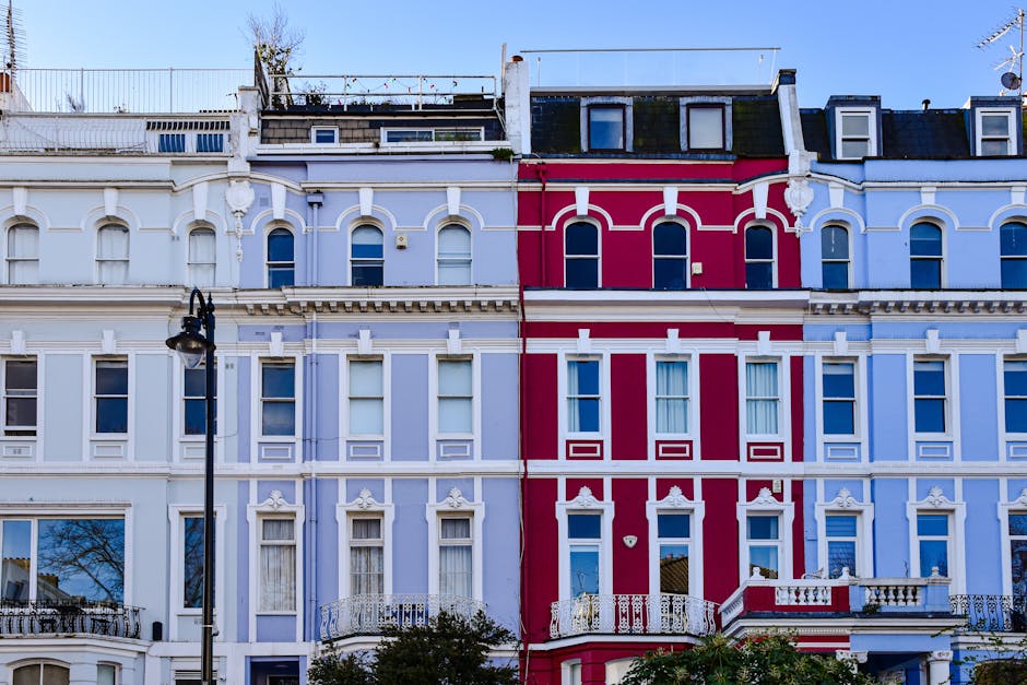 The exterior of a Victorian terraced home in Finchley, featuring a row of brick-built residential buildings with multiple windows and pitched roofs. The buildings have a classic architectural style wi